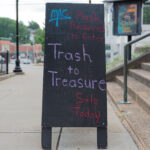 trash to treasure sign on sidewalk